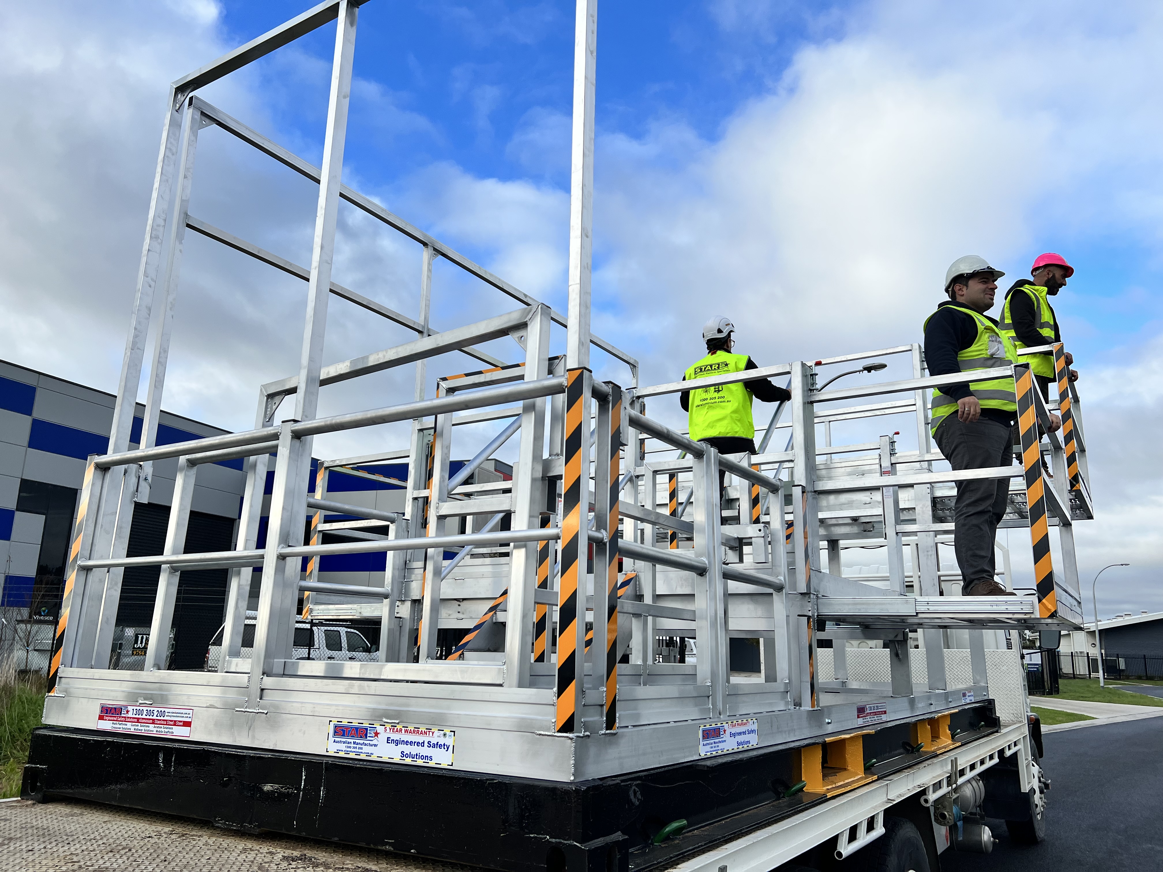 Workers using Star Aluminium height safety access platform on site